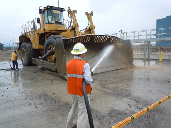Pressure washing oil field industrial equipment