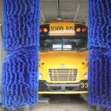 School bus in car wash tunnel
