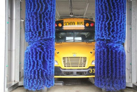 School bus in car wash tunnel