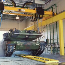 military vehicle in fleet wash tunnel